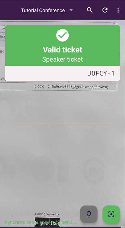 Scanning a ticket in pretixSCAN. A green box appears at the top of the screen, displaying a checkmark, the text: "Valid ticket (Speaker ticket)" and the order code suffixed with "-1".